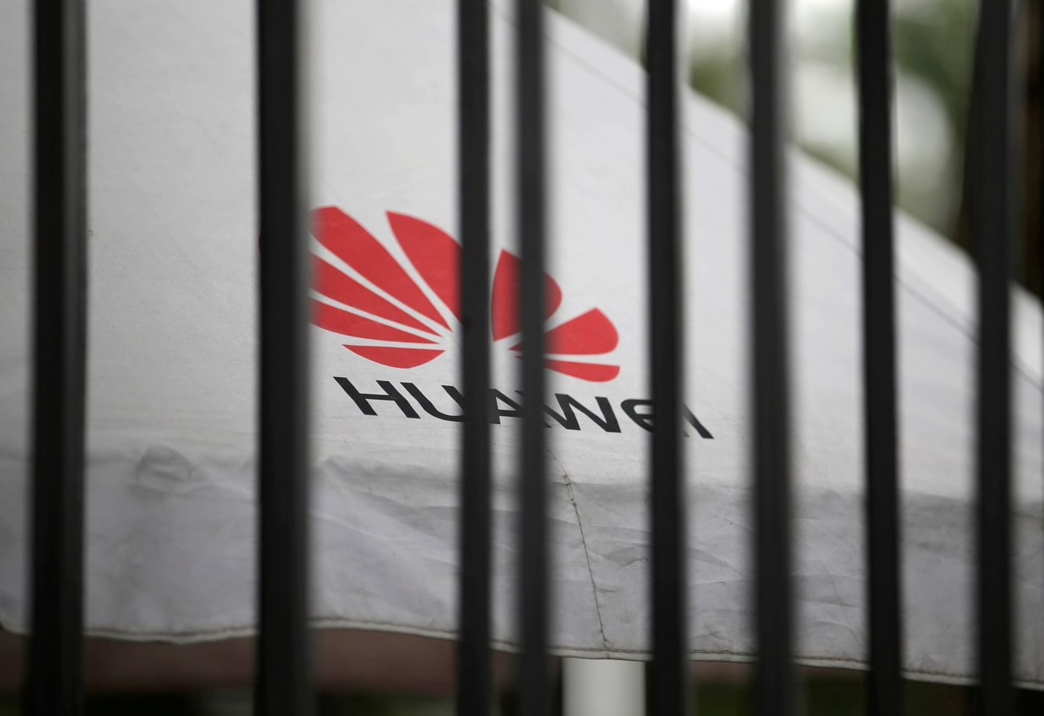 Huawei logo behind bars
